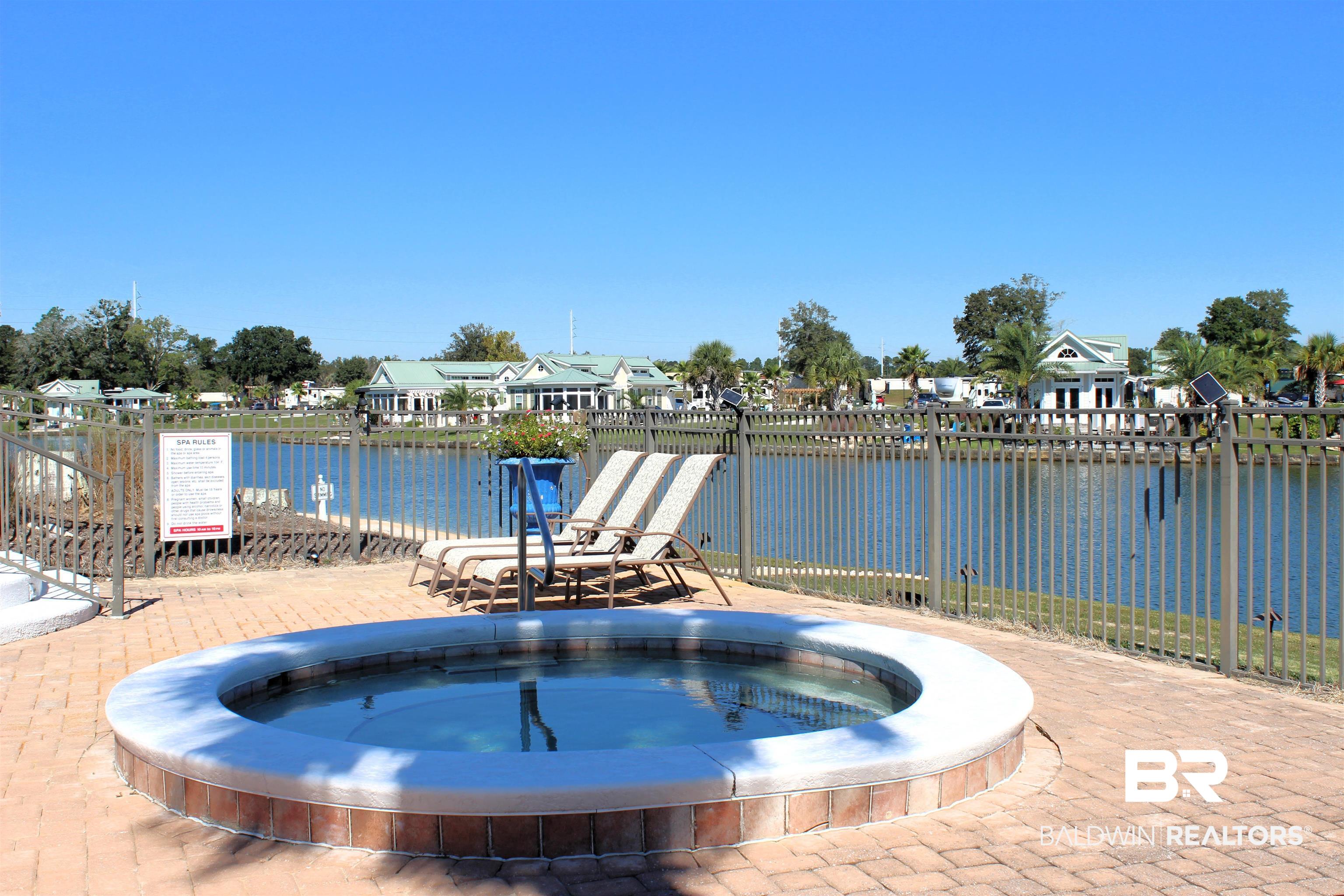 28114 Preserve Trail, Unit 190 Elberta, AL 36530 - Photo 43 of 69 View of swimming pool with a residential view, a water view, and a community hot tub