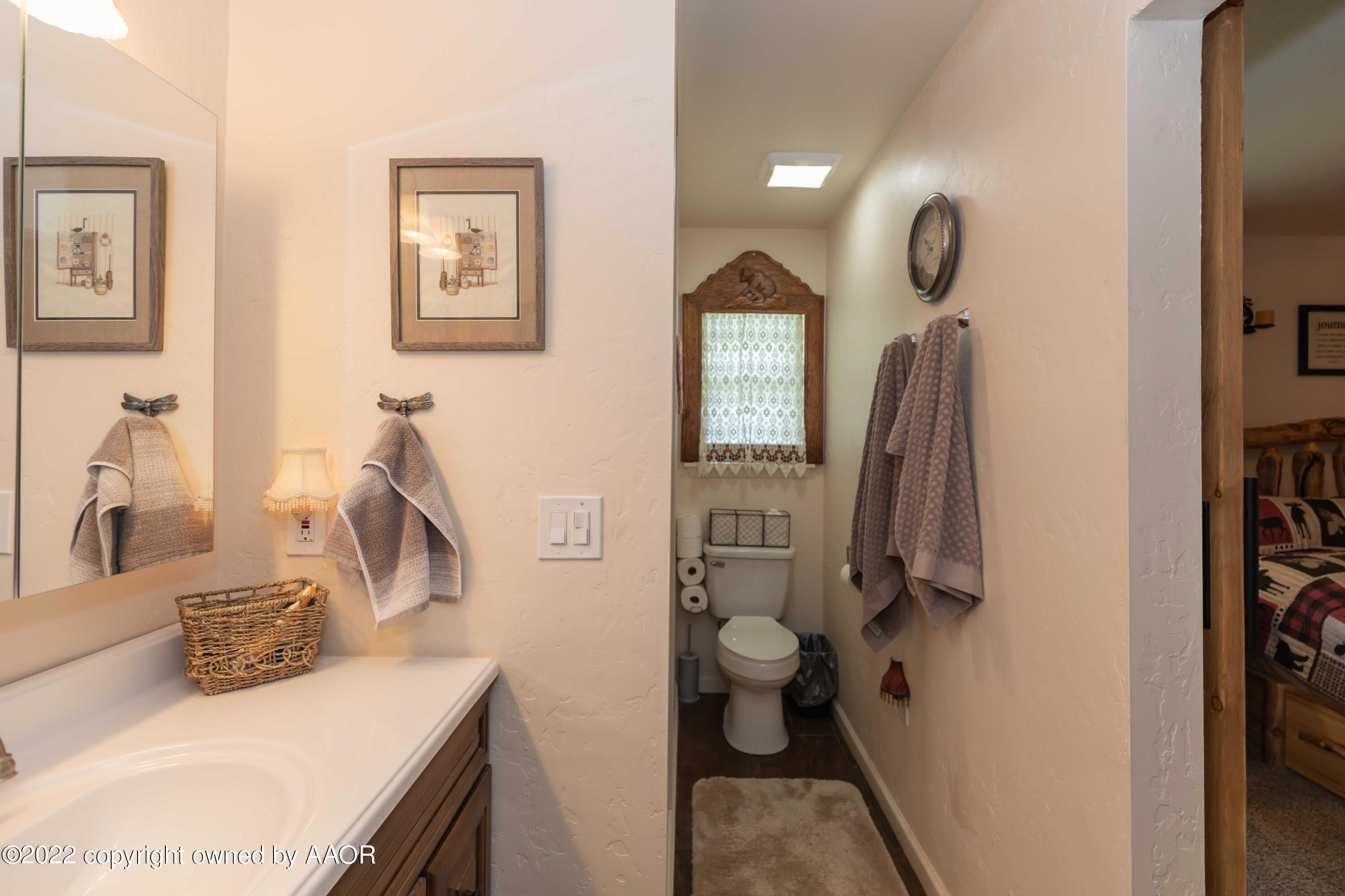 2816 Porter Drive Amarillo, TX 79110 - Photo 34 of 38 a bathroom with a sink toilet and shower