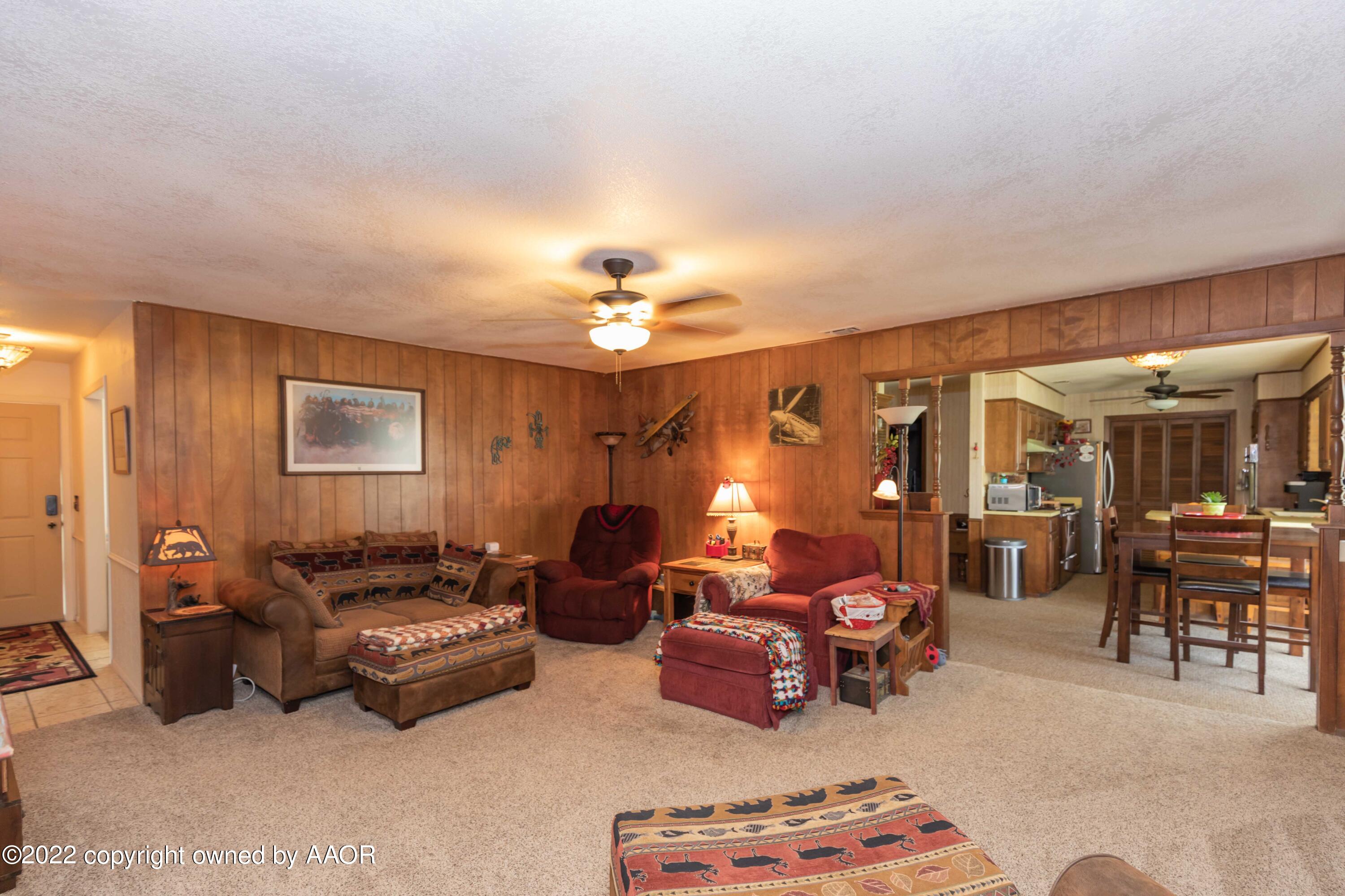 2816 Porter Drive Amarillo, TX 79110 - Photo 5 of 38 a living room with furniture and lamp