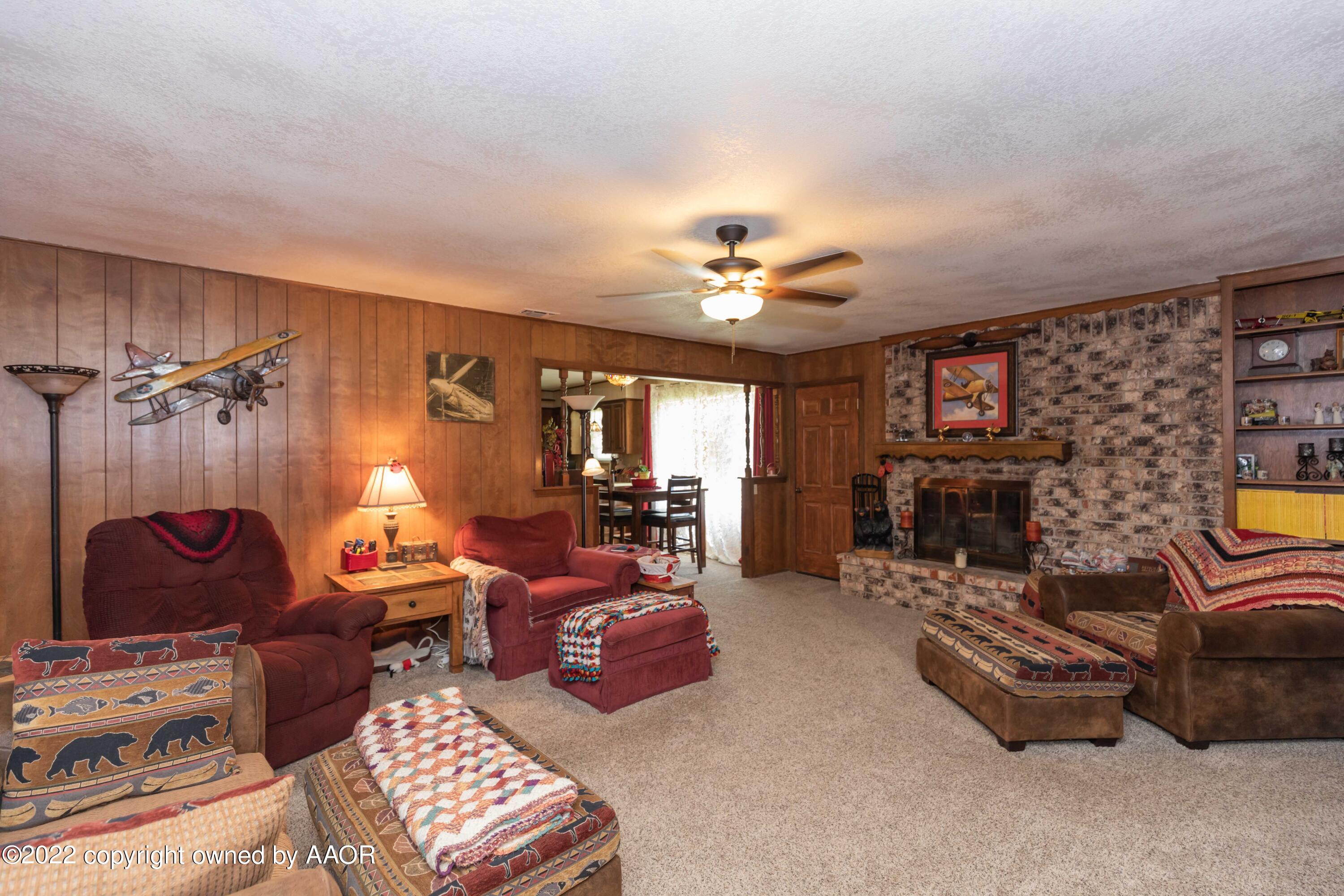 2816 Porter Drive Amarillo, TX 79110 - Photo 6 of 38 a view of a livingroom with furniture and a fireplace