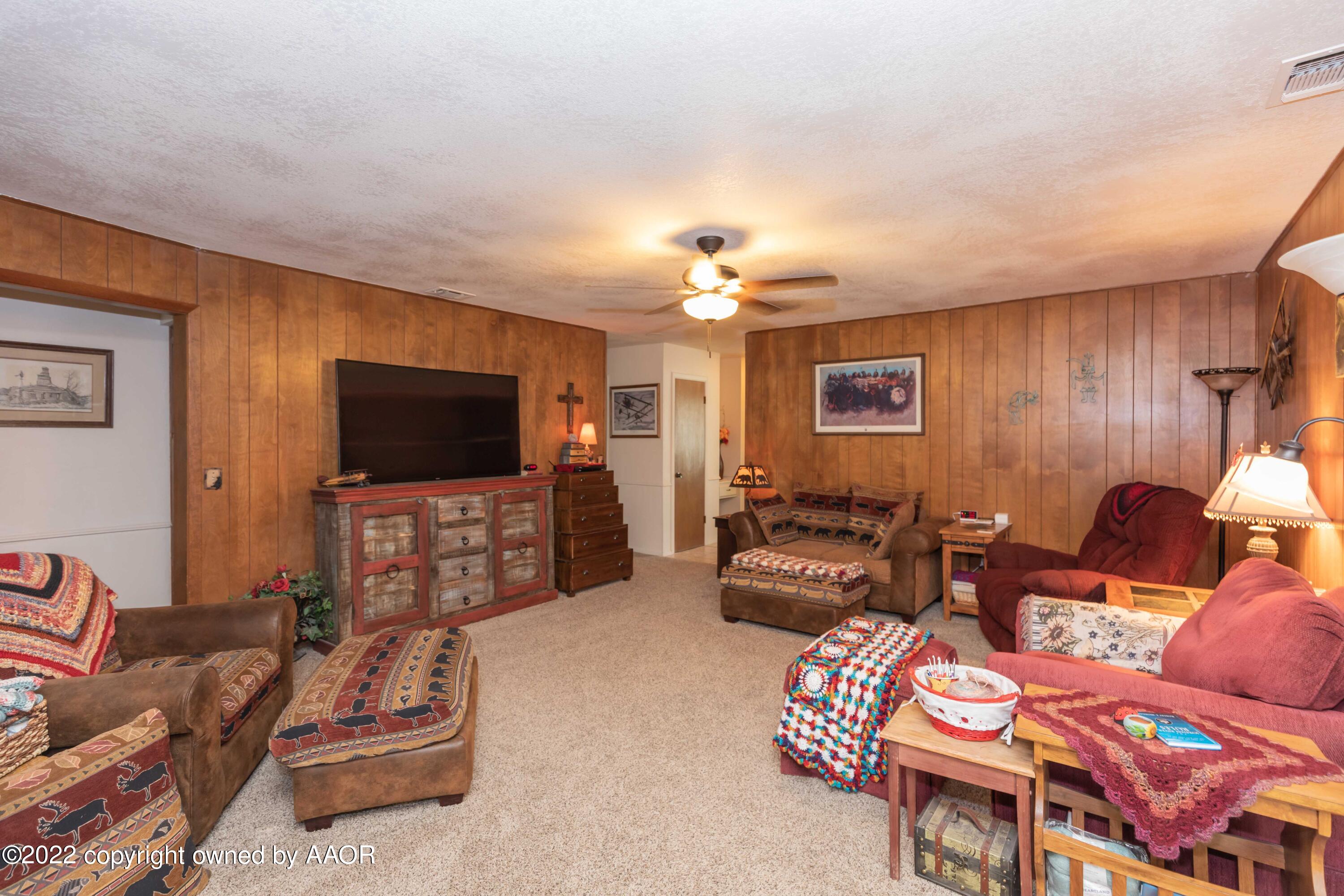 2816 Porter Drive Amarillo, TX 79110 - Photo 7 of 38 a living room with furniture and a flat screen tv