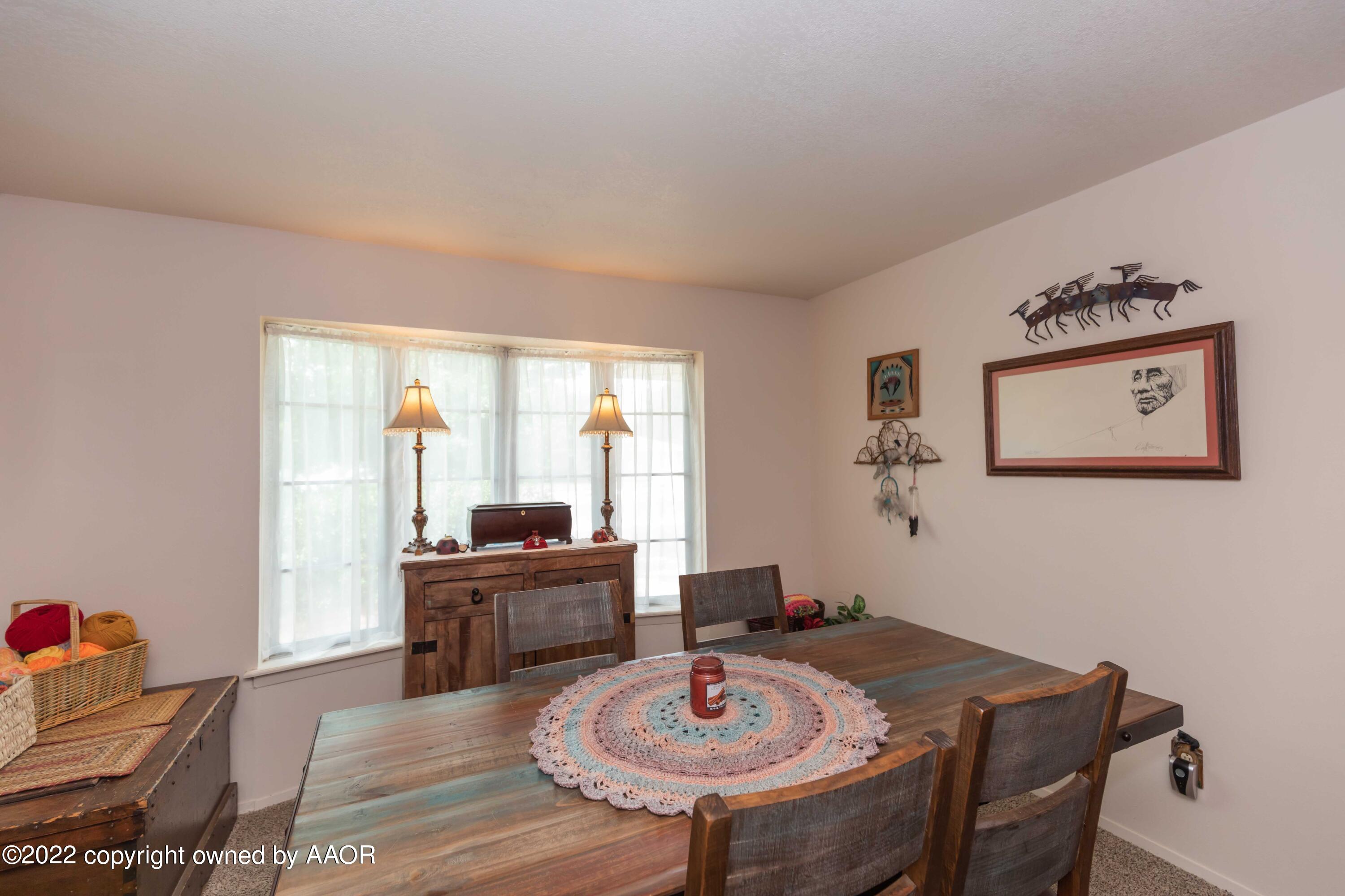 2816 Porter Drive Amarillo, TX 79110 - Photo 9 of 38 a view of a dining room with furniture window and wooden floor