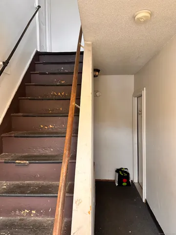 a view of entryway with wooden floor