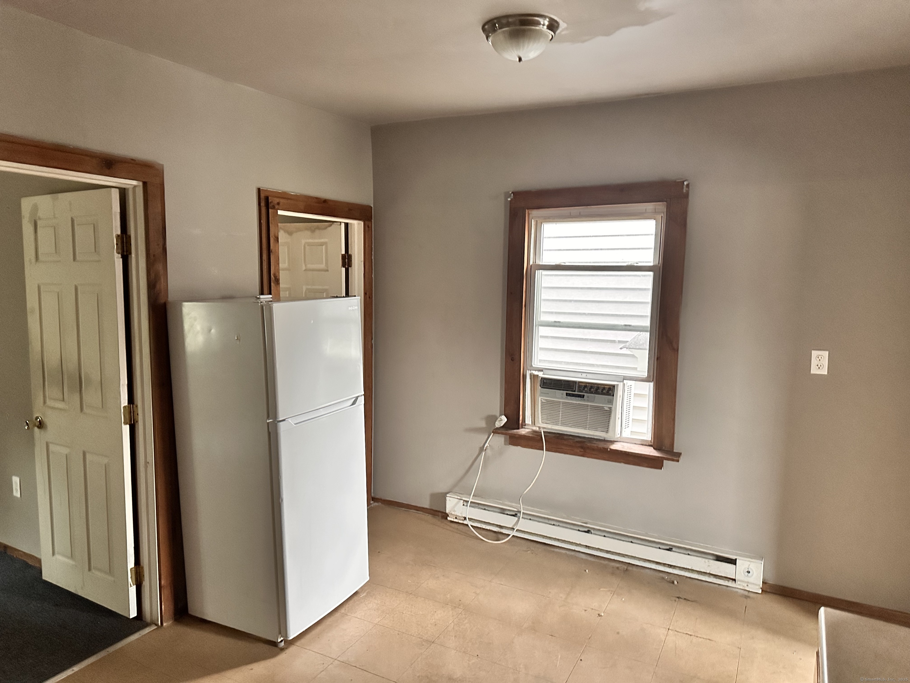 122 Willow Street Meriden, CT 06450 - Photo 4 of 13 a view of an empty room with a window