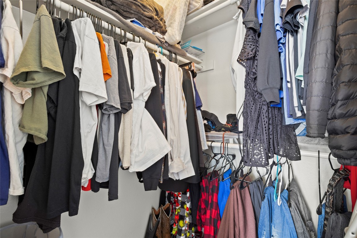 915 West 23rd Street, Unit 208 Austin, TX 78705 - Photo 5 of 16 a view of walk in closet with clothes and shoes