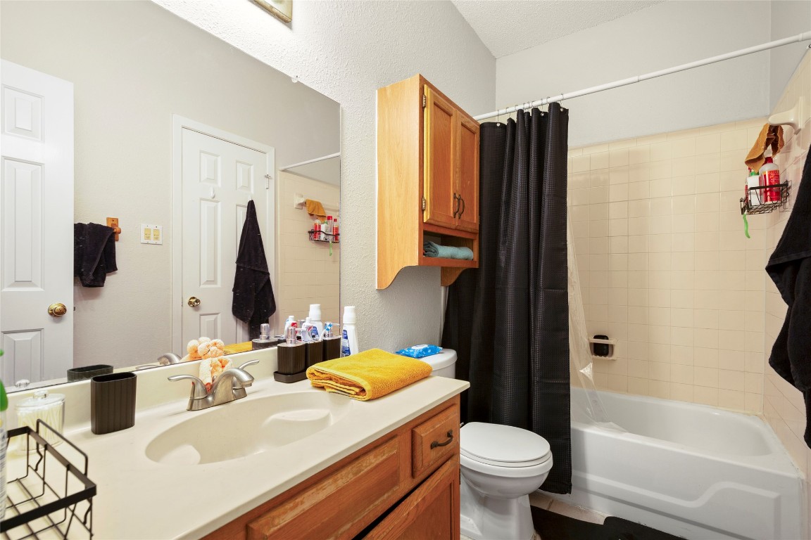 915 West 23rd Street, Unit 208 Austin, TX 78705 - Photo 8 of 16 a bathroom with a sink toilet and shower