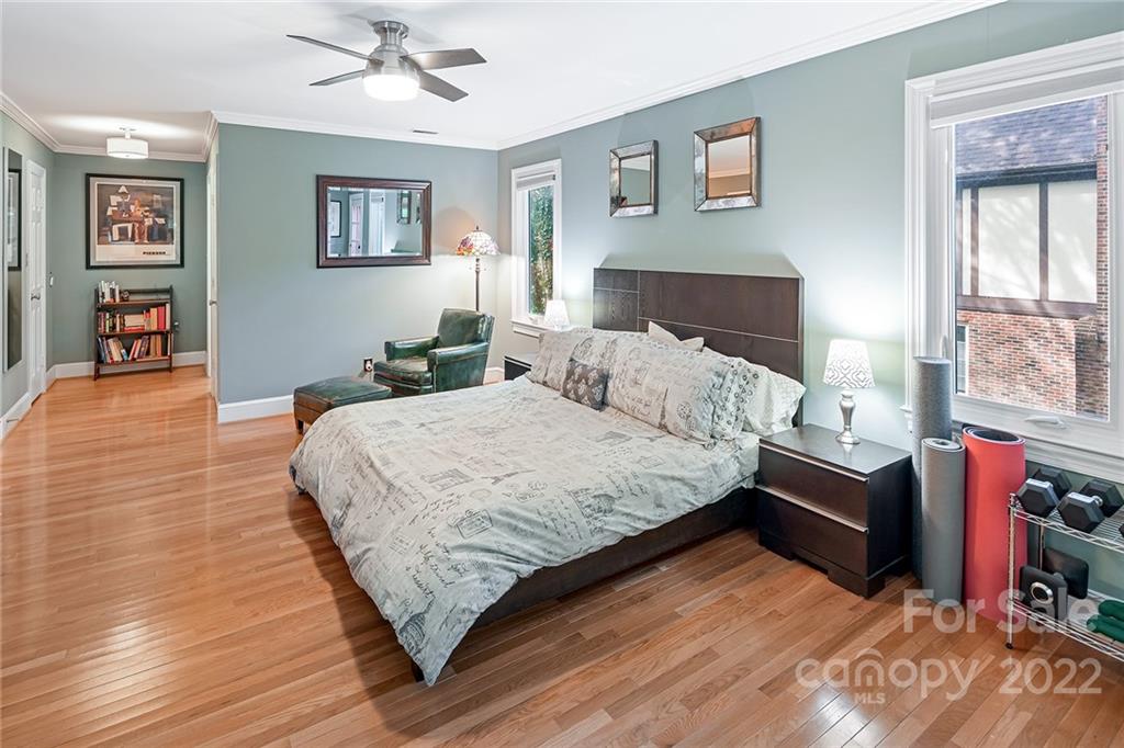 5428 Hillingdon Road Charlotte, NC 28226 - Photo 24 of 36 a bedroom with a bed and wooden floor