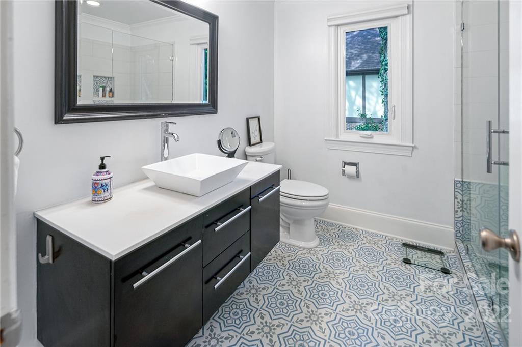5428 Hillingdon Road Charlotte, NC 28226 - Photo 25 of 36 a bathroom with a sink toilet and mirror