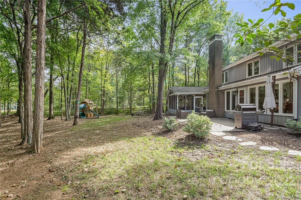 5428 Hillingdon Road Charlotte, NC 28226 - Photo 34 of 36 a view of a house with a yard and tree