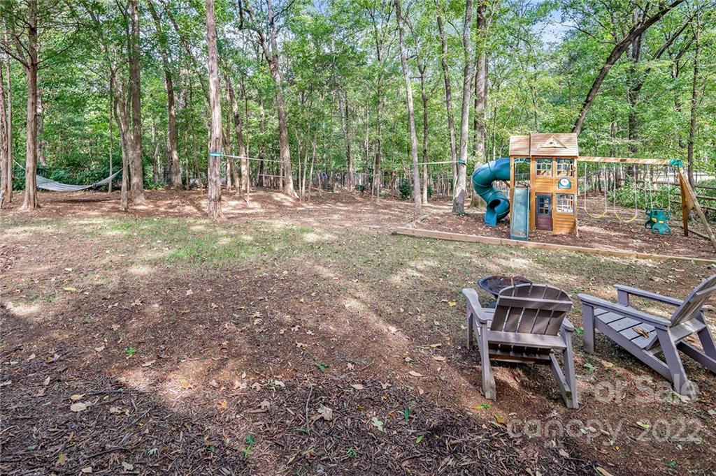 5428 Hillingdon Road Charlotte, NC 28226 - Photo 35 of 36 a view of a yard with furniture