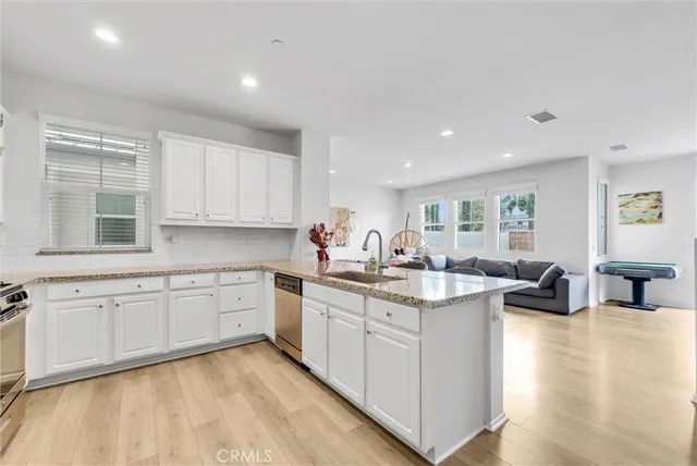 a kitchen with sink and cabinets