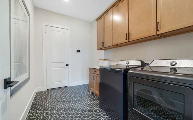a kitchen with stainless steel appliances a stove a sink and cabinets