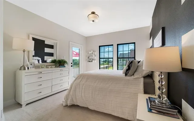 a bedroom with a bed and a dresser