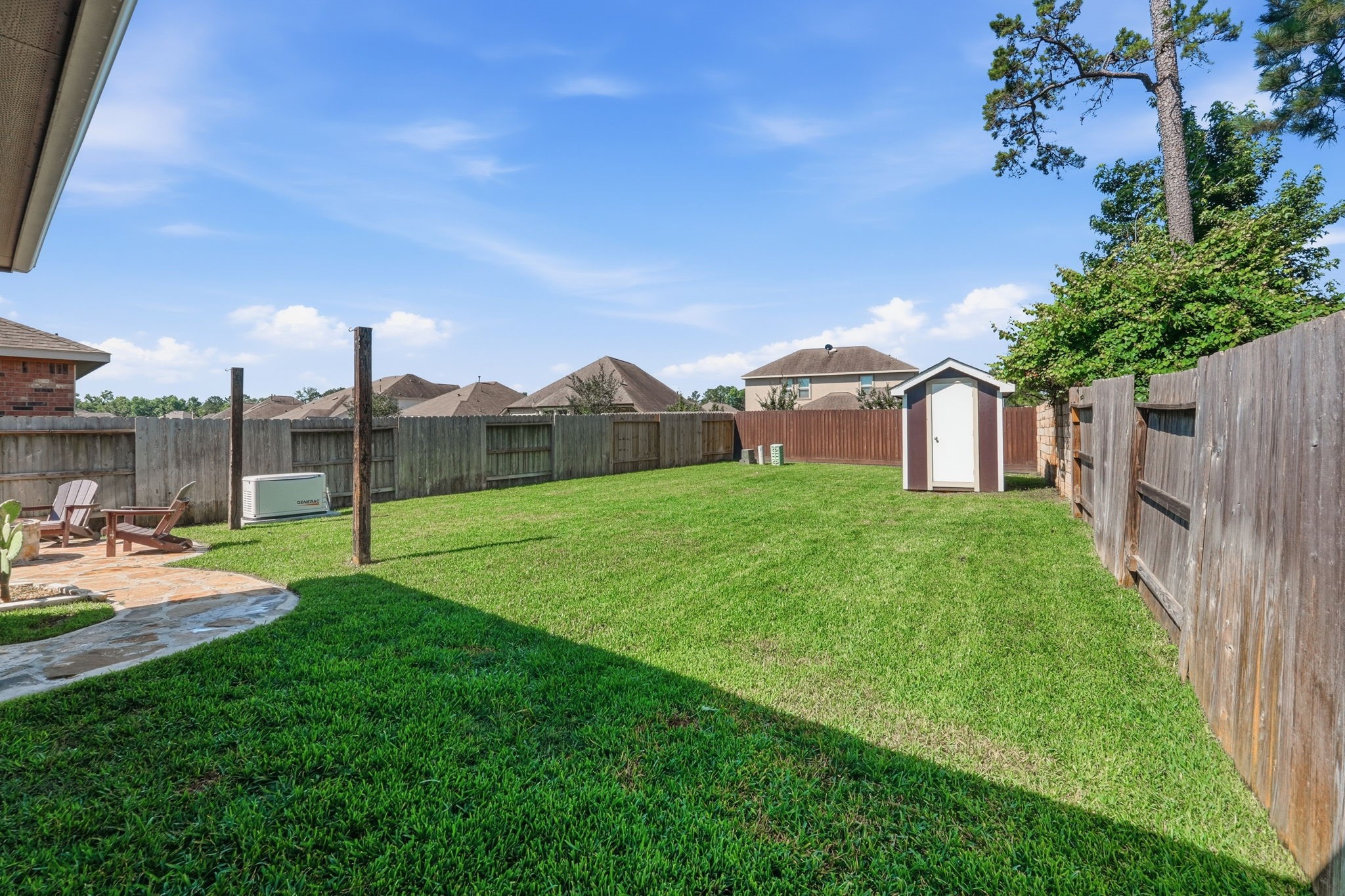 4334 Umber Shadow Drive Spring, TX 77386 - Photo 37 of 45 Alternate view highlights the generous backyard lawn and fully fenced outdoor space.