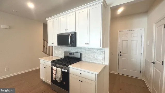 a white toilet sitting next to a bath tub
