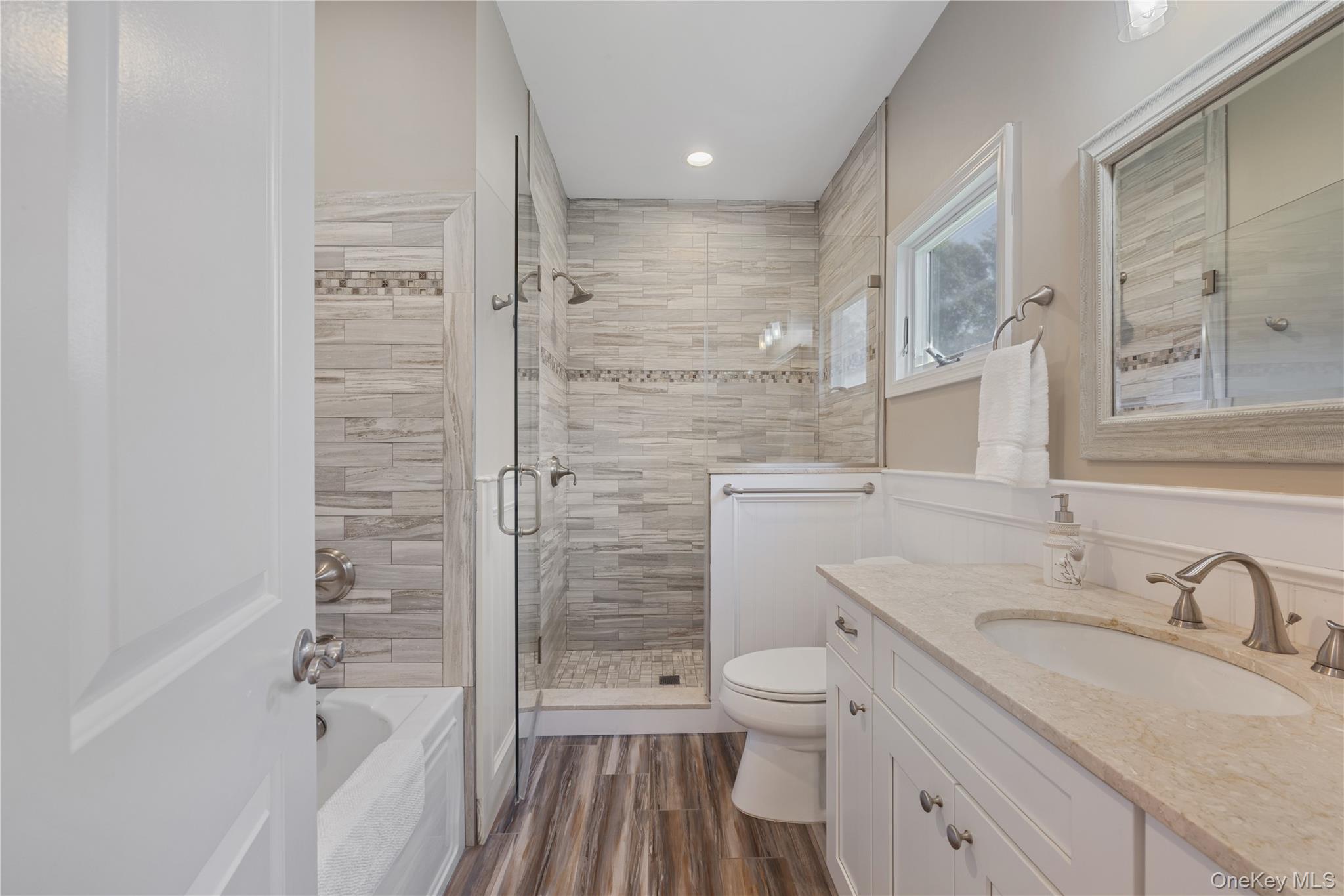 380 Homestead Way Greenport, NY 11944 - Photo 22 of 39 a bathroom with a granite countertop sink toilet and shower