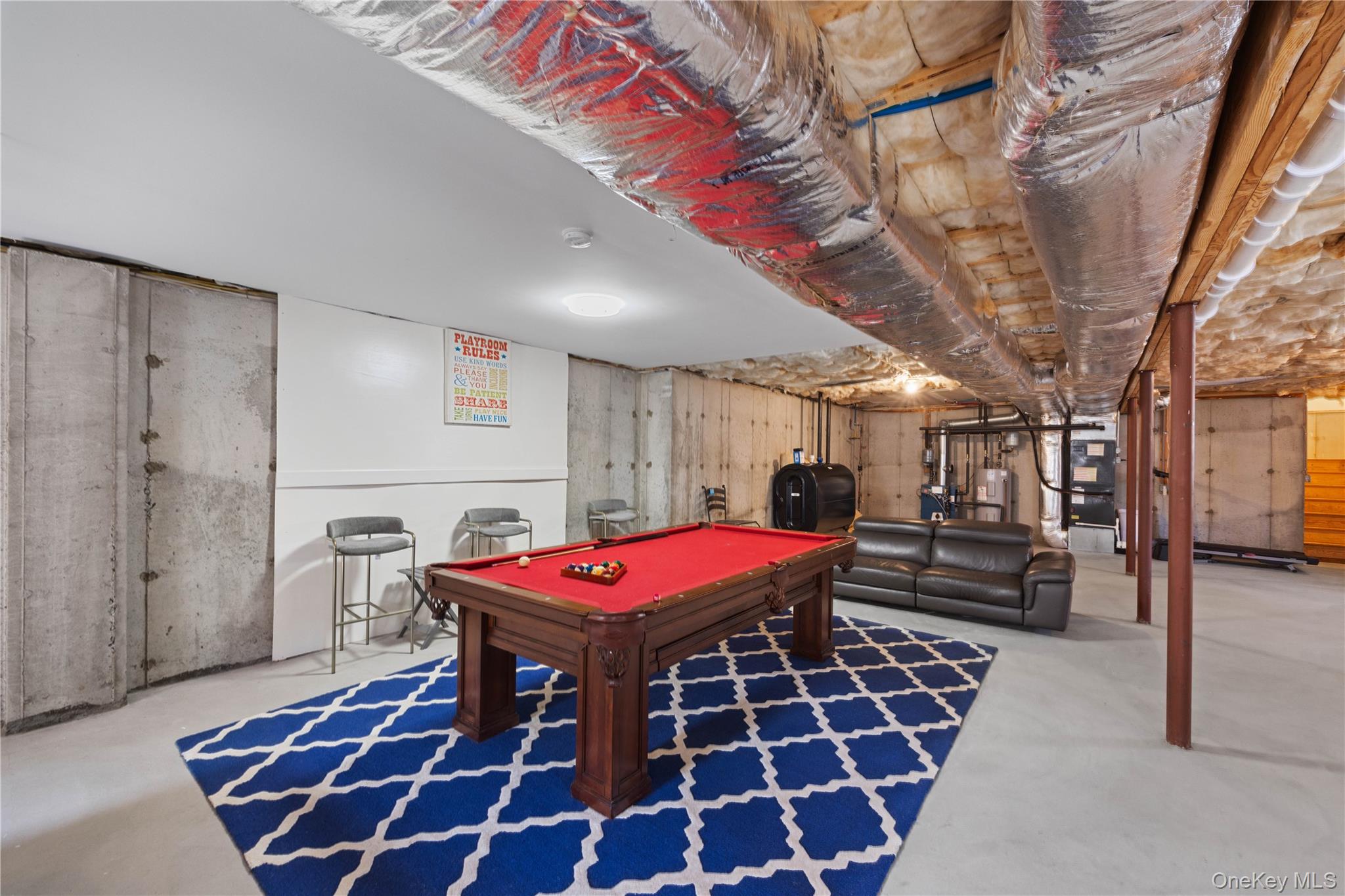 380 Homestead Way Greenport, NY 11944 - Photo 28 of 39 a dinning area with pool table and chairs