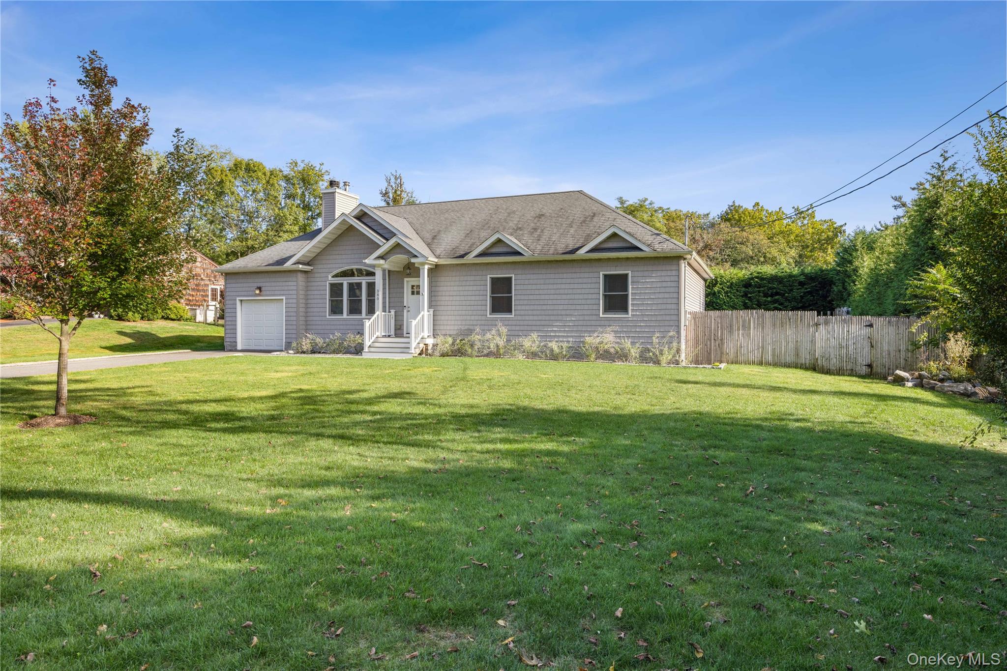 380 Homestead Way Greenport, NY 11944 - Photo 3 of 39 a front view of house with yard and green space