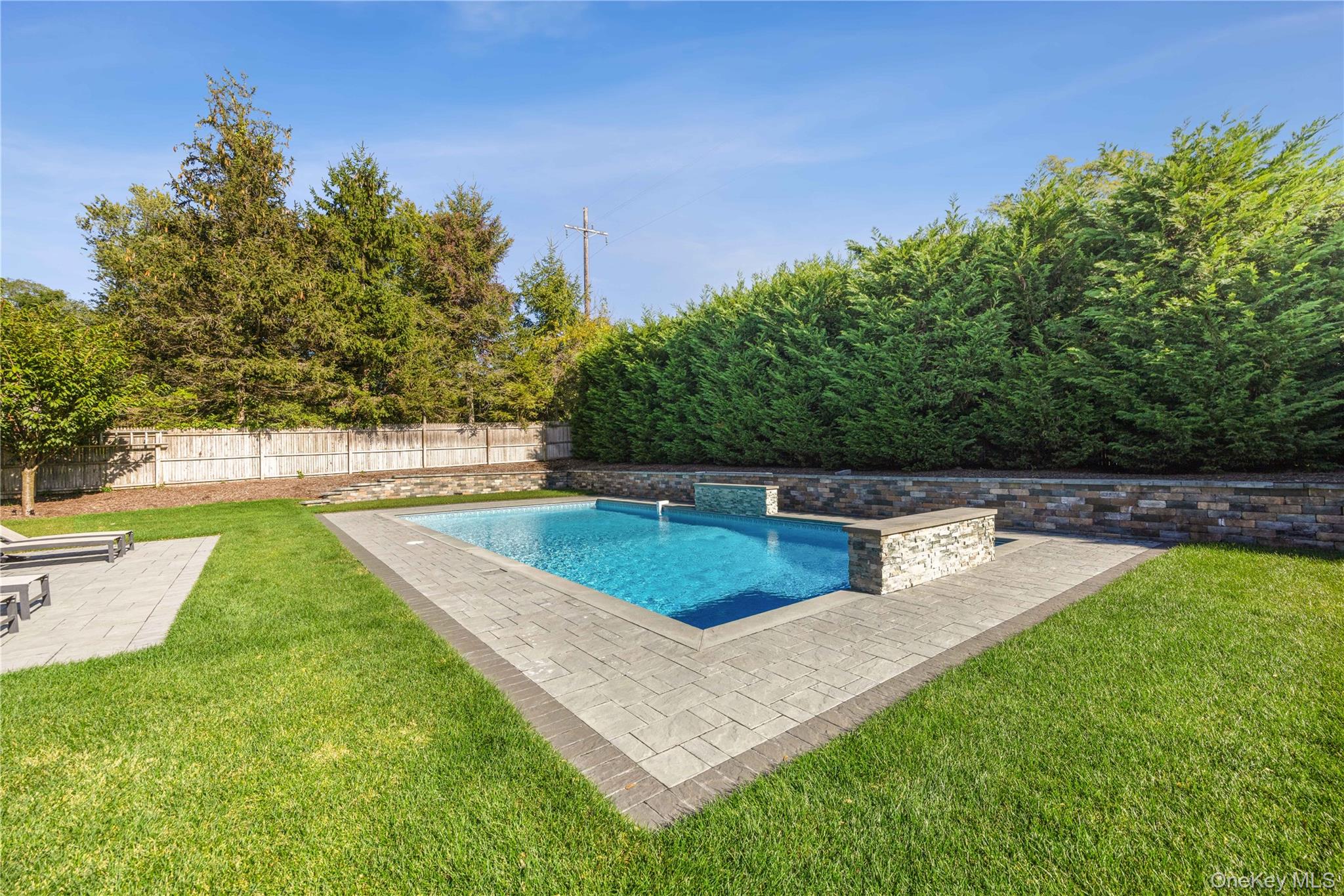 380 Homestead Way Greenport, NY 11944 - Photo 34 of 39 a view of a backyard with large trees