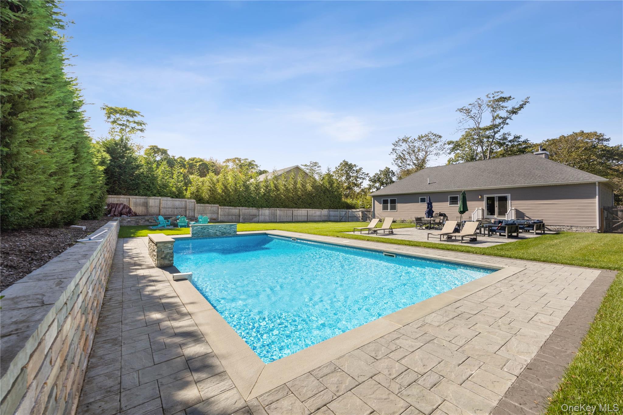380 Homestead Way Greenport, NY 11944 - Photo 35 of 39 a view of a house with swimming pool and sitting area