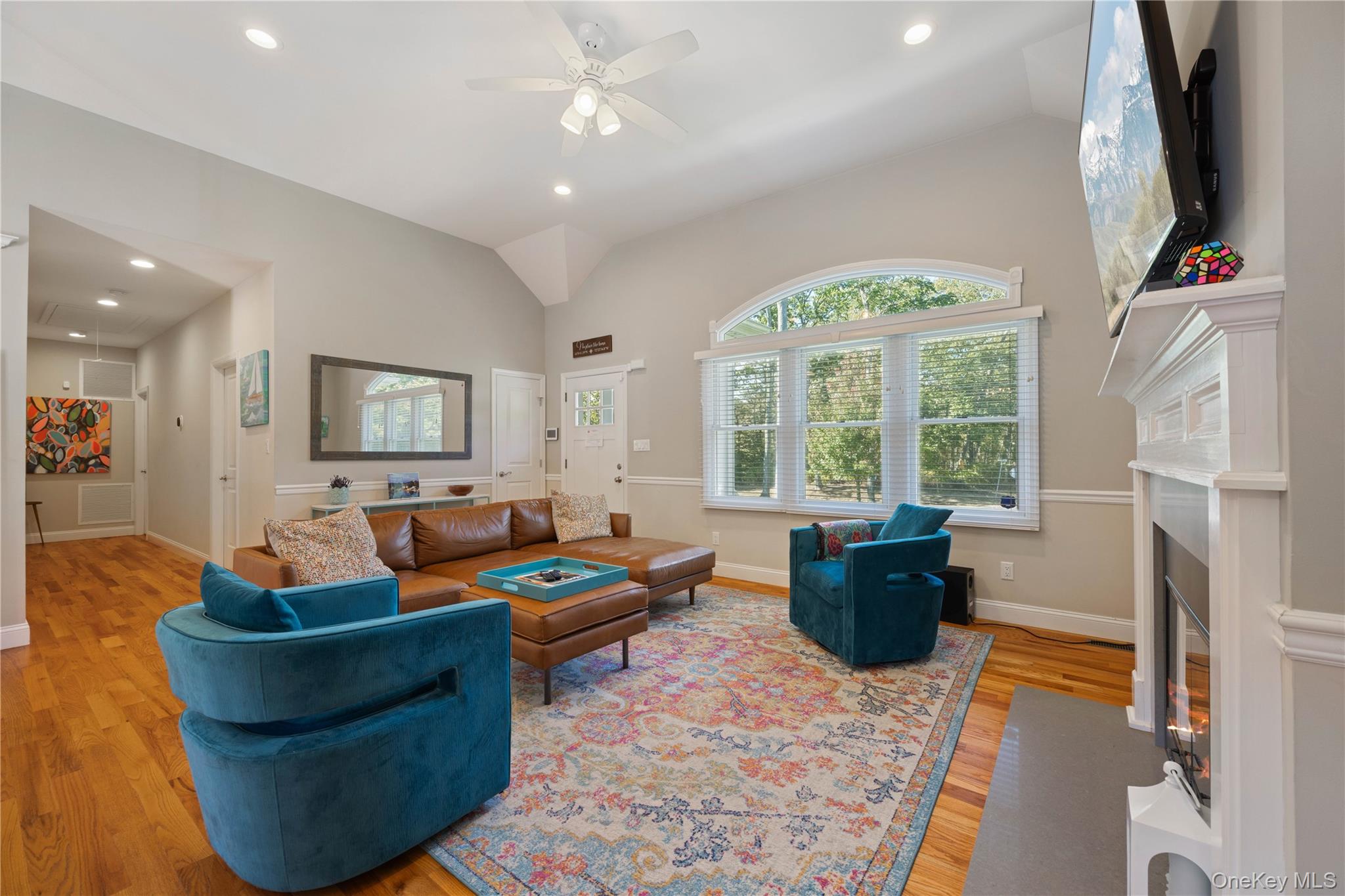 380 Homestead Way Greenport, NY 11944 - Photo 6 of 39 a living room with fireplace furniture and a large window