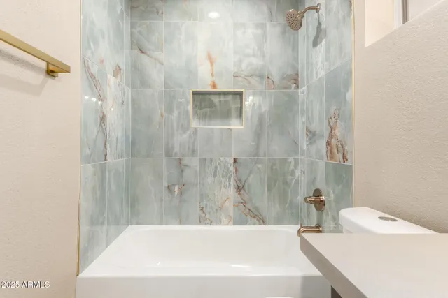 a bathroom with a white bath tub