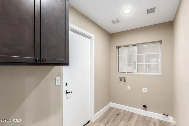 a view of an empty room with windows