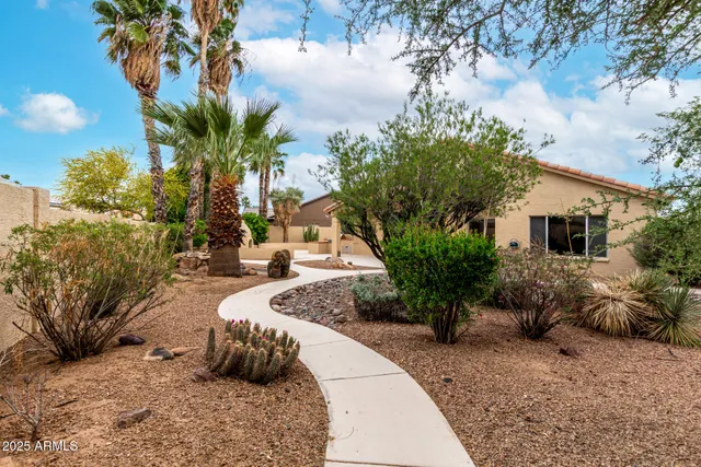 a view of a backyard of the house
