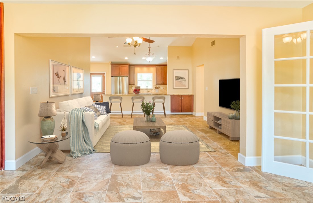 1813 Long Point Lane Sanibel, FL 33957 - Photo 13 of 38 a living room with furniture and a flat screen tv