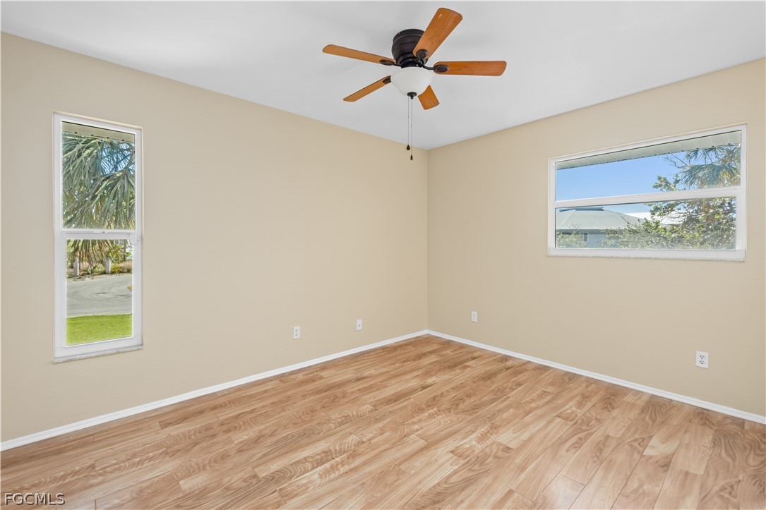 1813 Long Point Lane Sanibel, FL 33957 - Photo 18 of 38 a view of an empty room with a window
