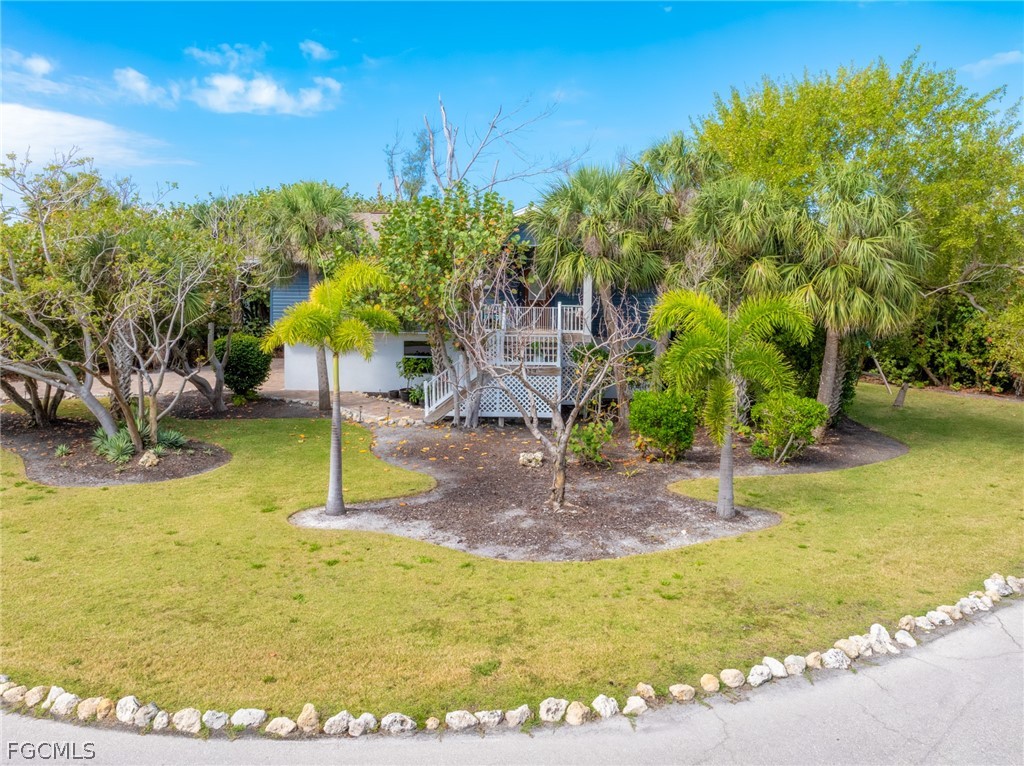 1813 Long Point Lane Sanibel, FL 33957 - Photo 2 of 38 a view of a yard
