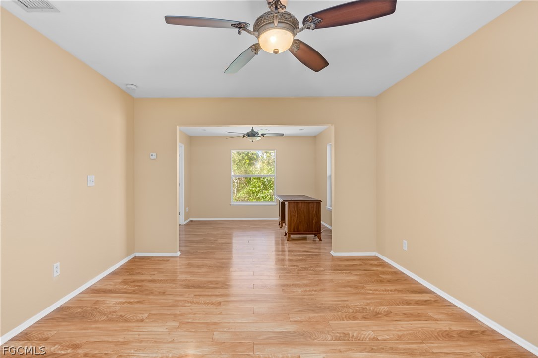1813 Long Point Lane Sanibel, FL 33957 - Photo 25 of 38 a view of empty room with wooden floor