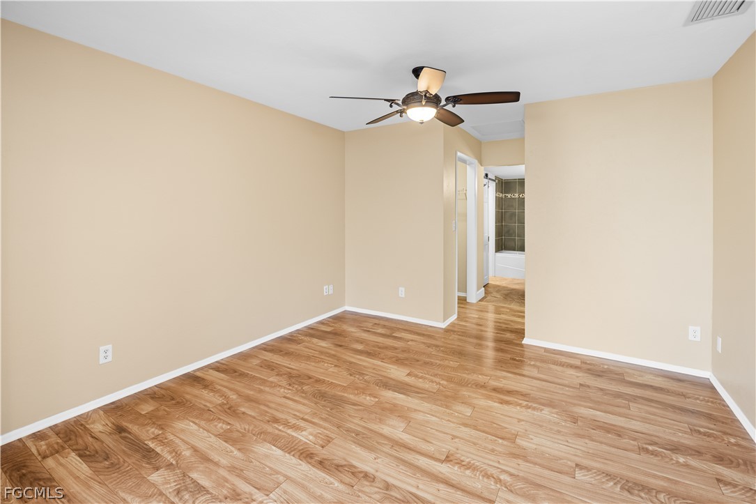1813 Long Point Lane Sanibel, FL 33957 - Photo 26 of 38 a view of empty room with wooden floor