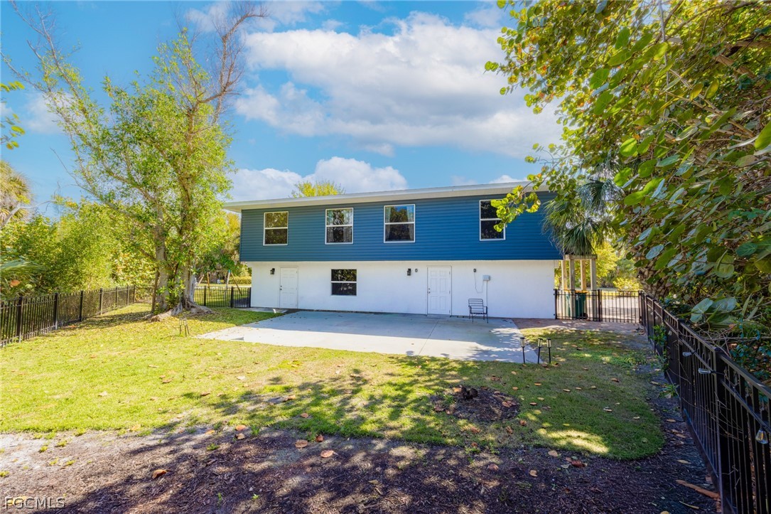 1813 Long Point Lane Sanibel, FL 33957 - Photo 30 of 38 a view of a house with swimming pool and garden