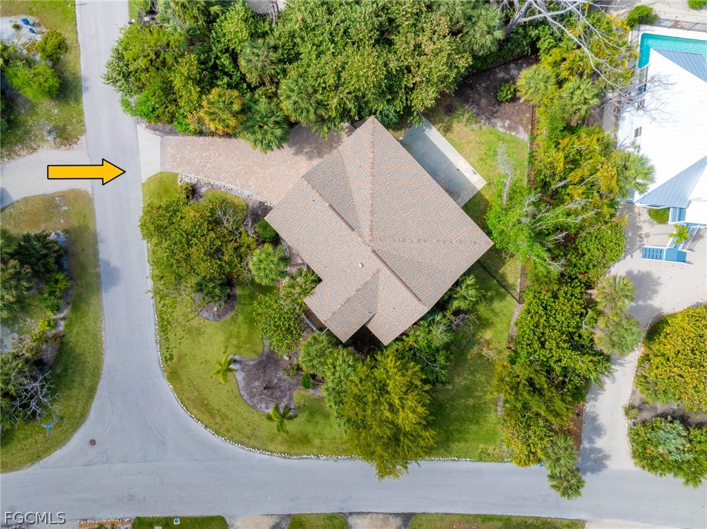 1813 Long Point Lane Sanibel, FL 33957 - Photo 33 of 38 an aerial view of a house with swimming pool and garden