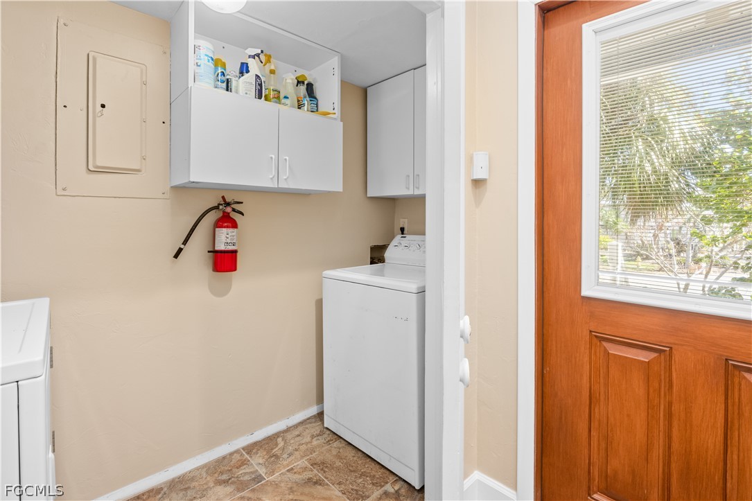 1813 Long Point Lane Sanibel, FL 33957 - Photo 4 of 38 a view of storage and utility room with a window
