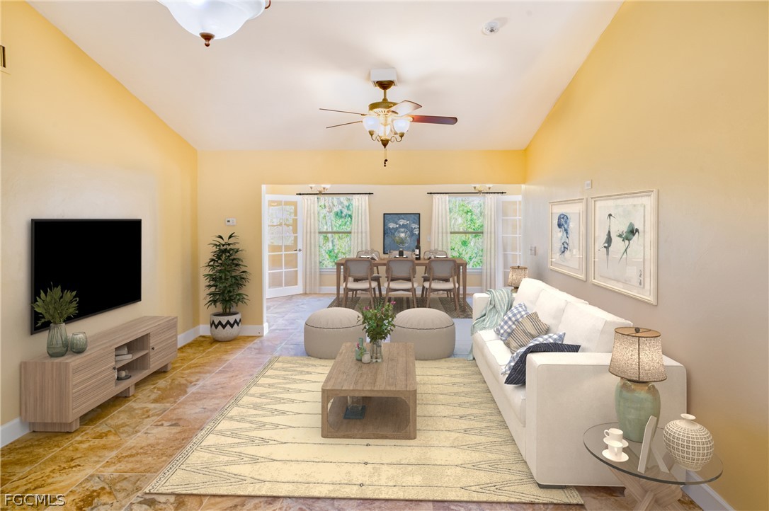 1813 Long Point Lane Sanibel, FL 33957 - Photo 10 of 38 a living room with furniture and a flat screen tv