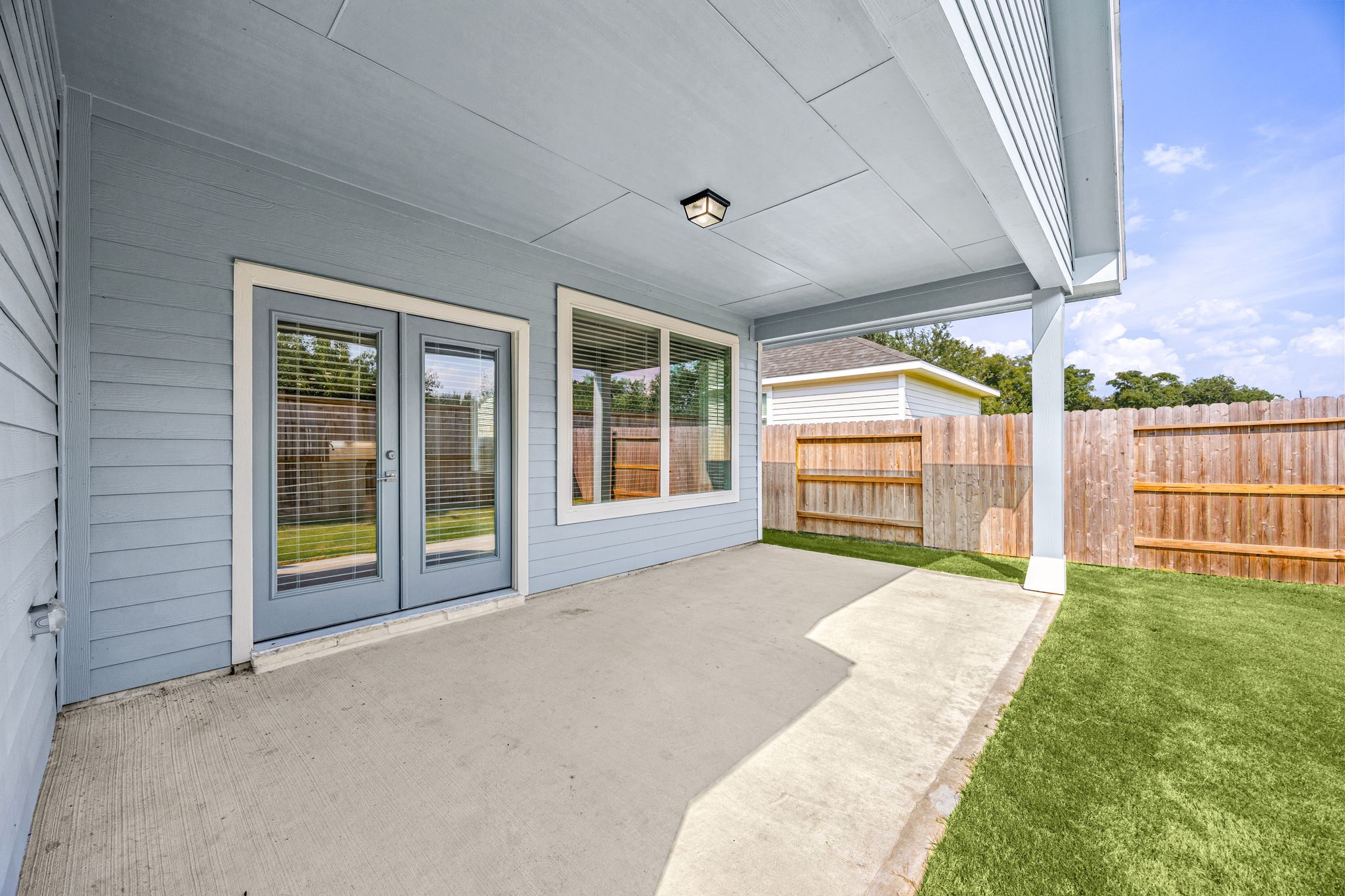 33007 Carolyns Perfection Loop Fulshear, TX 77441 - Photo 28 of 31 Covered patio which is perfect for relaxing after a hard days work.