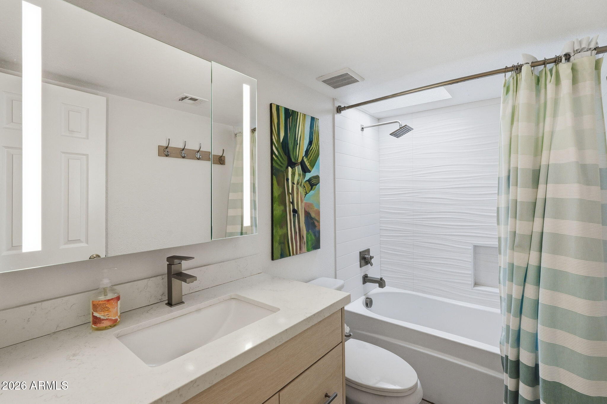 4201 East Camelback Road, Unit 34 Phoenix, AZ 85018 - Photo 14 of 19 a bathroom with a granite countertop sink toilet and shower