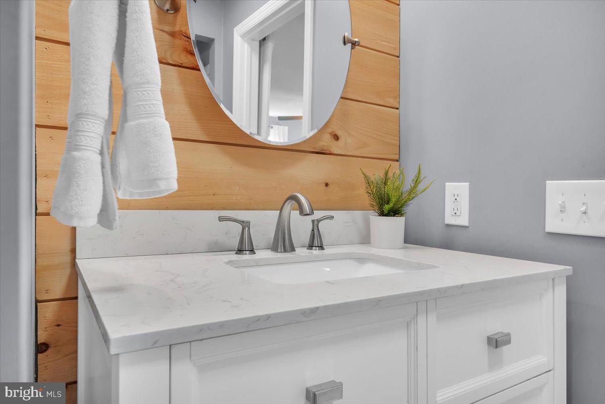216 Evergreen Avenue Mantua, NJ 08051 - Photo 13 of 30 a bathroom with a sink and a mirror