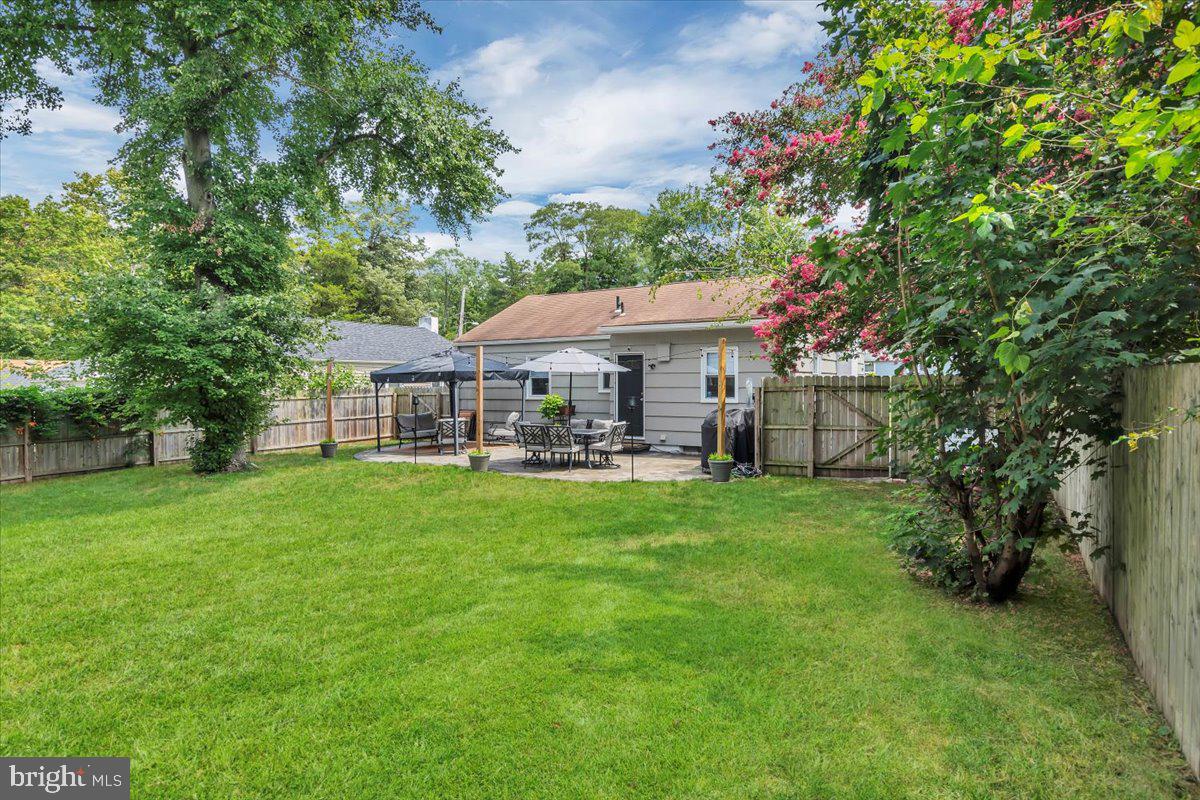 216 Evergreen Avenue Mantua, NJ 08051 - Photo 22 of 30 a front view of a house with yard and green space