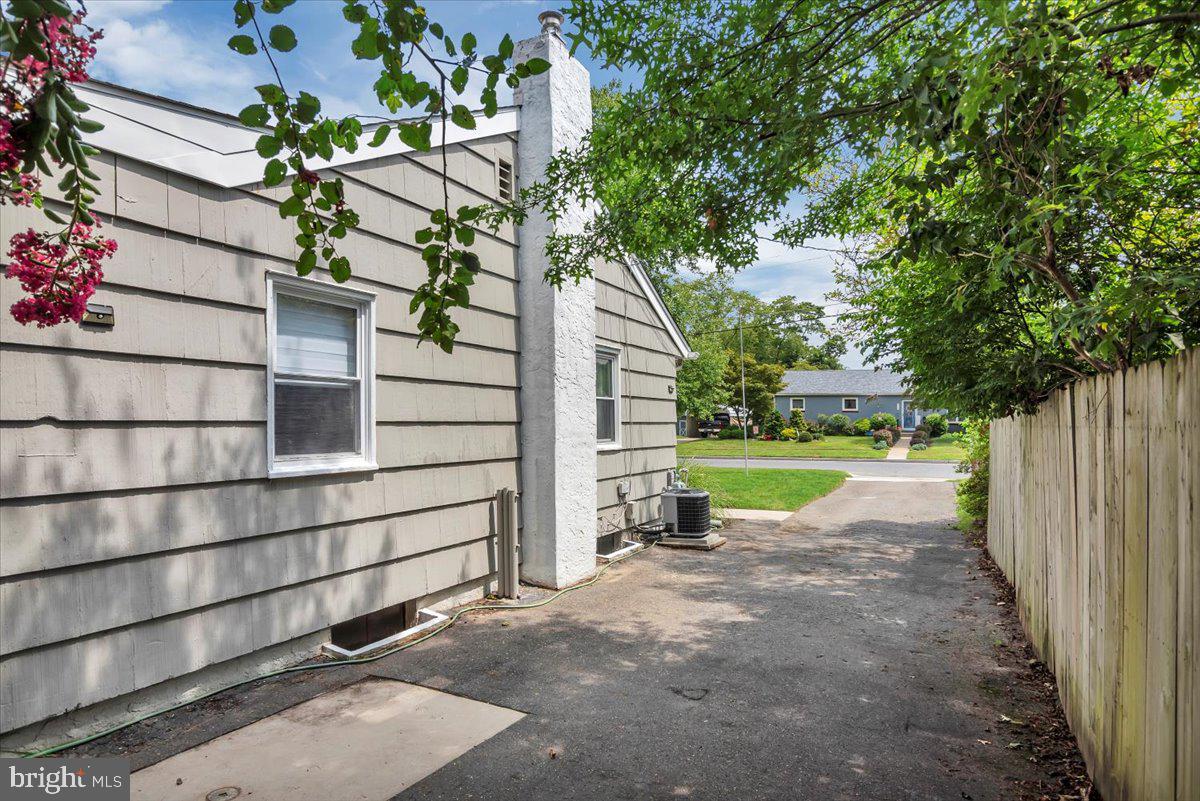 216 Evergreen Avenue Mantua, NJ 08051 - Photo 25 of 30 a view of backyard with wooden fence and large trees
