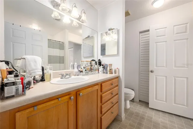 a bathroom with a sink double vanity and a mirror