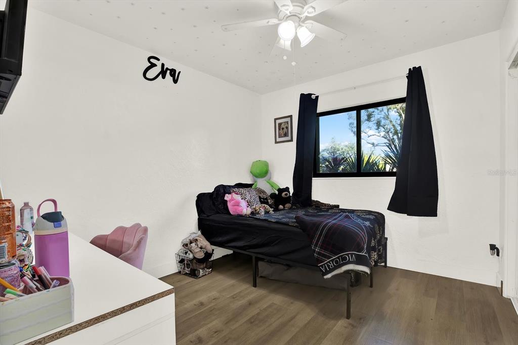 6060 39th Avenue North St. Petersburg, FL 33709 - Photo 18 of 29 a living room with furniture and wooden floor