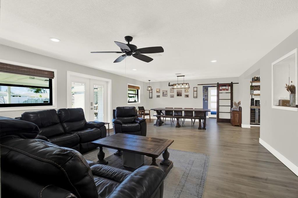 6060 39th Avenue North St. Petersburg, FL 33709 - Photo 24 of 29 a living room with furniture and wooden floor