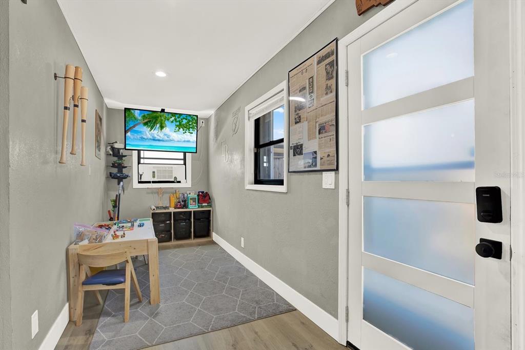 6060 39th Avenue North St. Petersburg, FL 33709 - Photo 25 of 29 a kitchen with furniture and a window