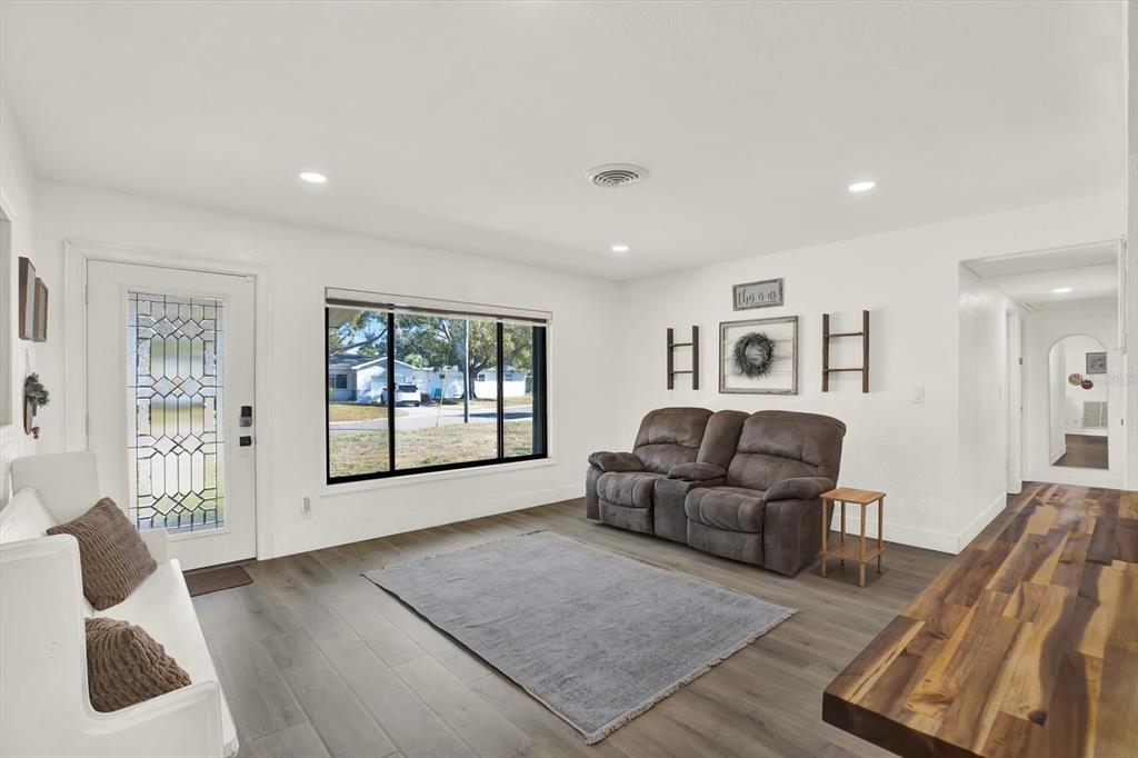 6060 39th Avenue North St. Petersburg, FL 33709 - Photo 4 of 29 a living room with furniture and a window