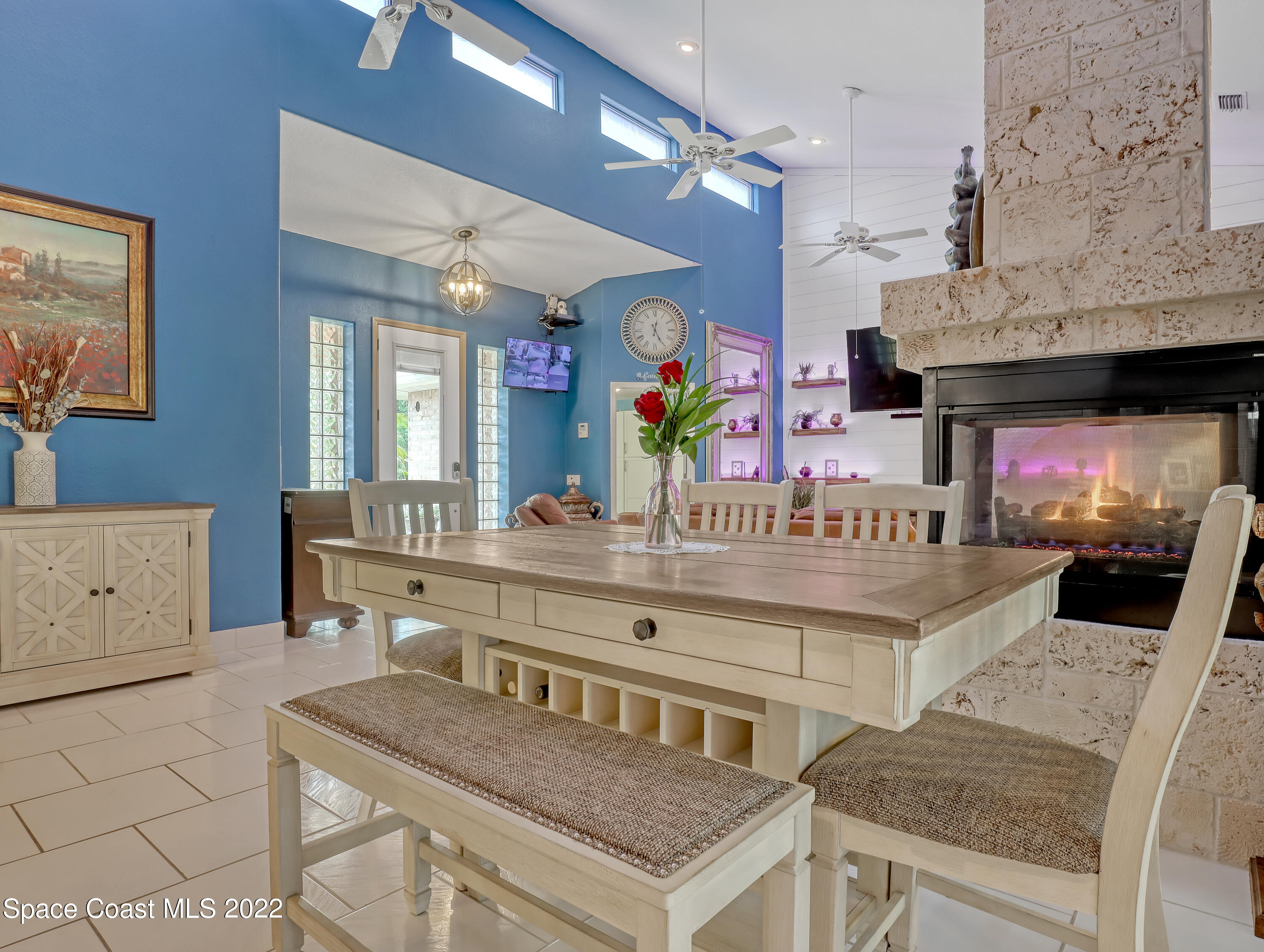 4304 Long Lake Road Melbourne, FL 32934 - Photo 7 of 40 a view of kitchen island with stainless steel appliances kitchen island granite countertop a table and chairs in it