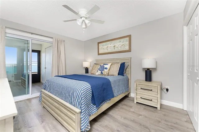 a bedroom with a bed and a lamp on table