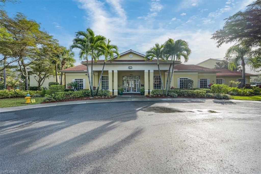 8288 Key Royal Lane, Unit 1424 Naples, FL 34119 - Photo 12 of 13 front view of house with a yard
